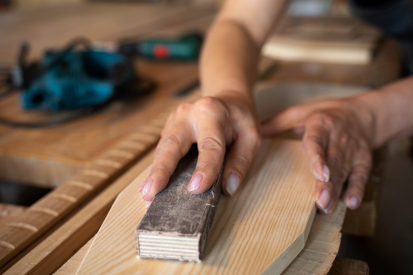 high-angle-woman-measuring-wood